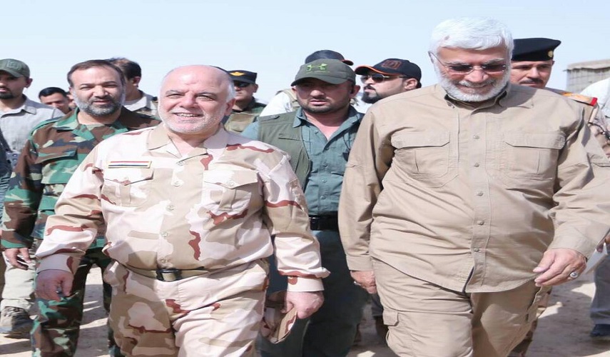 العبادي والمهندس يؤكدان على الدفاع عن الحشد الشعبي وتدمير داعش