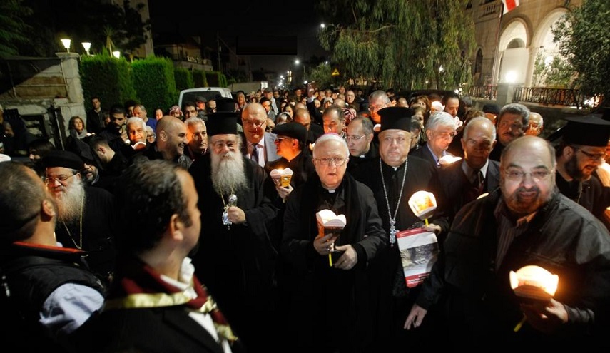 عمّان.. مسيرة شموع والكنائس تقرع أجراسها من أجل القدس