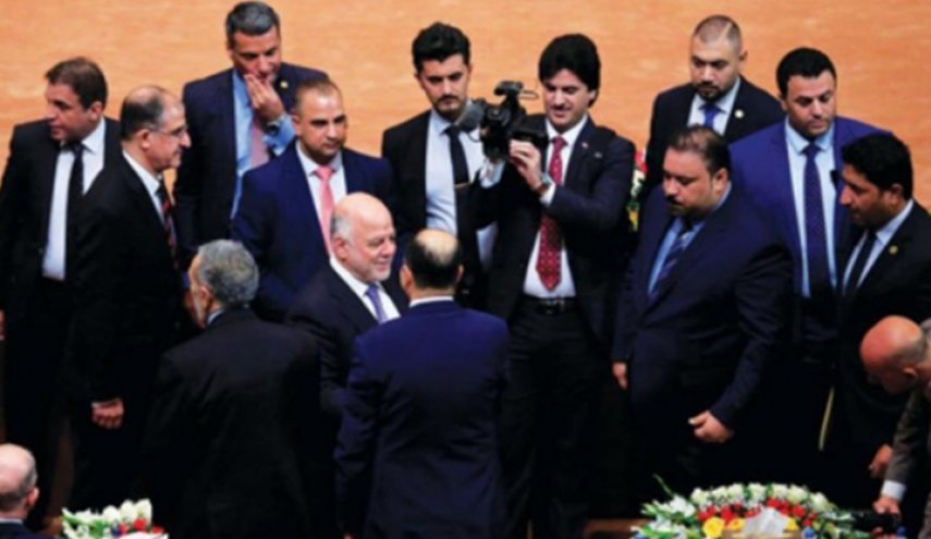  مشادة كلامية بين حماية العبادي وحراس البرلمان العراقي + صورة 