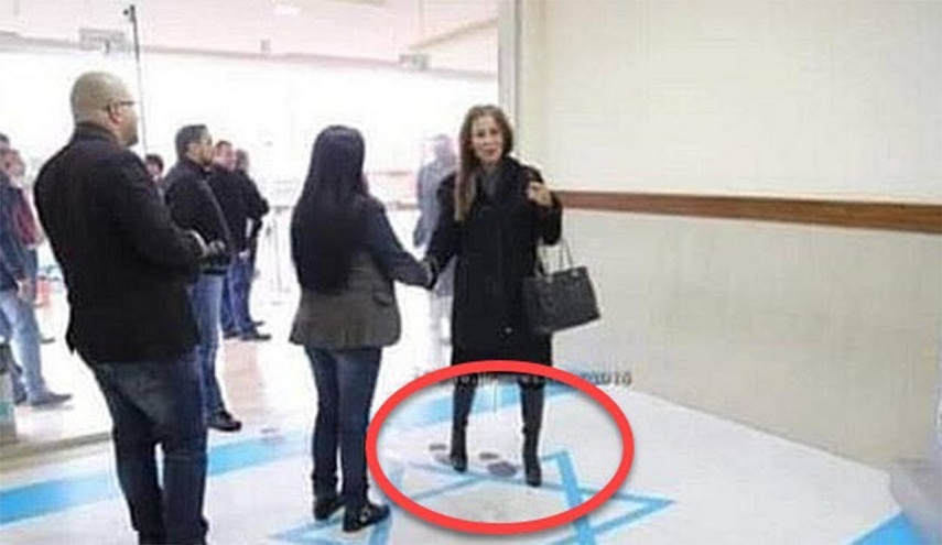 وزيرة أردنية تدوس العلم الإسرائيلي وتُغضب تل أبيب